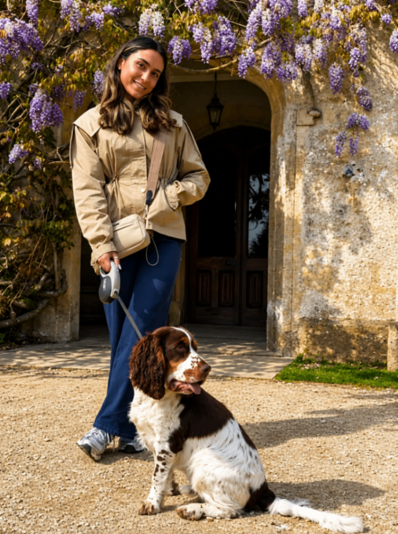 Happy dog with caregiver in a cosy home — safe and reliable pet care in Surrey